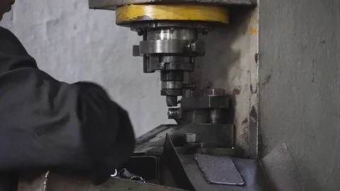 Man working with a metal pressing machine Stock Footage 83794905
