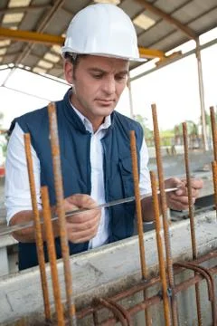 Man working on metal structure Stock Photos