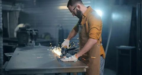 Man working with metal at the workshop Stock Footage 147293145