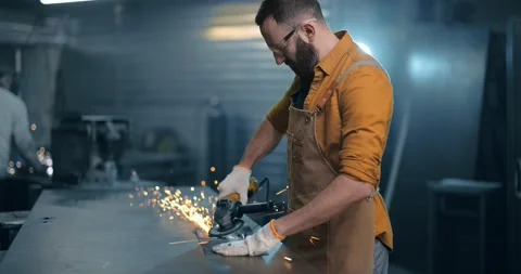 Man working with metal at the workshop Stock Footage 147293223