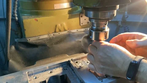 Man working on metalworking machine, changing the head of the machine Stock Footage 228646961