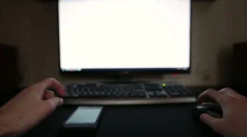 Man working with mobile device and PC 動画素材 48950888