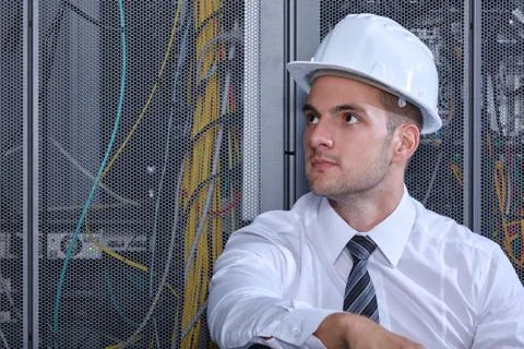 Man working in a modern datacenter server room Stock Photos