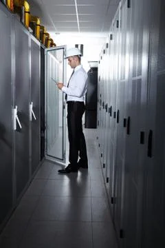 Man working in a modern  server room Stock Photos