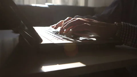 Man working on my laptop in the background sunlight Stock Footage 120291868