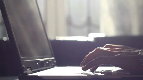 Man working on my laptop in the background sunlight Stock Footage 120291897