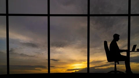 The man working near the window with a cloud stream view Stock-Footage 111486325