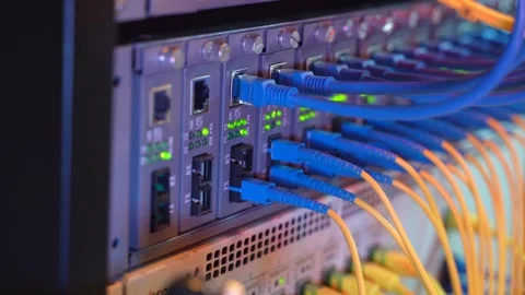 Man working in network server room with fiber optic hub Stock Footage 137236947