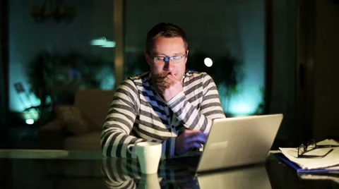 Man working at night and looking tired. Видео 36908113