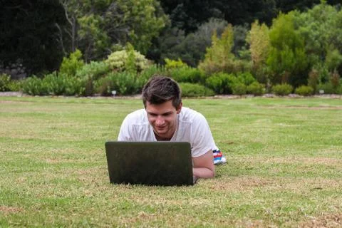 Man working on notebook outdoors Stock-Fotos