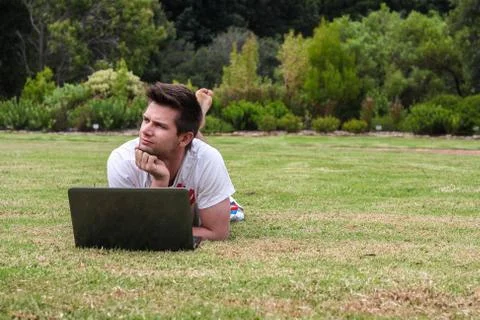 Man working on notebook outdoors Stock Photos