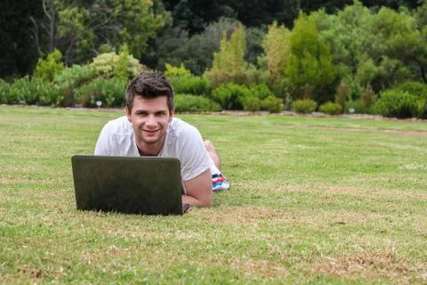 Man working on notebook outdoors Foto stock