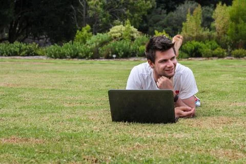 Man working on notebook outdoors Foto stock