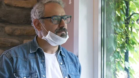 Man working in the office and looking out the window with coffee. Stock Footage 132290706