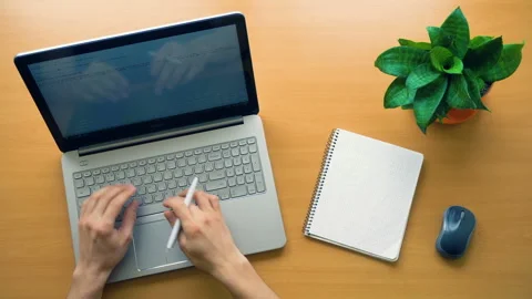Man working at office desk with his laptop, hands top view, timelapse shot Stock Footage 87380751