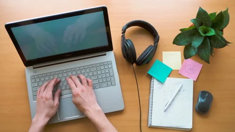 Man working at office desk with his laptop, hands top view, timelapse shot Stock Footage 87878797