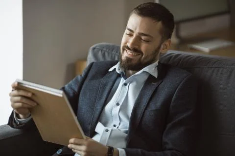Man Working In Office Doing Notes Stock Photos