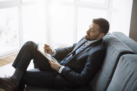 Man Working In Office Doing Notes Stock Photos
