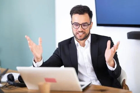 Man working in office, manager using laptop in work Stock Photos