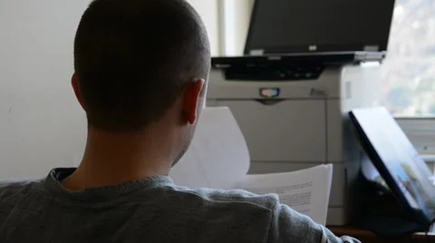Man working in the office, reading papers Stock Footage 39764267