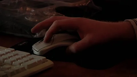 Man Working With an Old Computer Mouse on a Personal Computer in a Dark Room Stock Footage 190804870