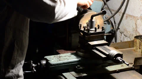  Man working on an old style lathe closeup Stock Footage 24654683