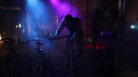 Man Working out with Exercise Bike Stock Footage 32398939