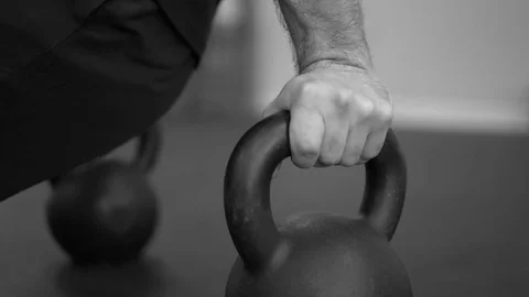 Man working out with kettle bell handles slow motion (B&amp;W) Stock Footage 73128509