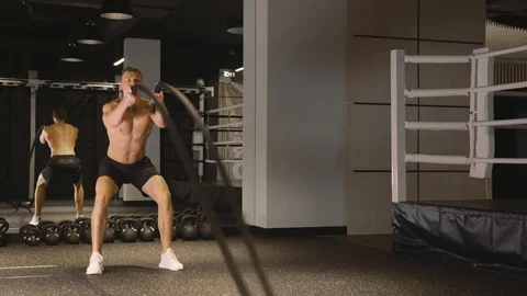 Man working out with ropes Stock Footage 89591065