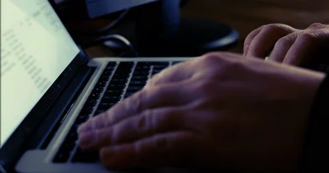Man working over night using computer at work place, typing on keyboard Stock Footage 103453172