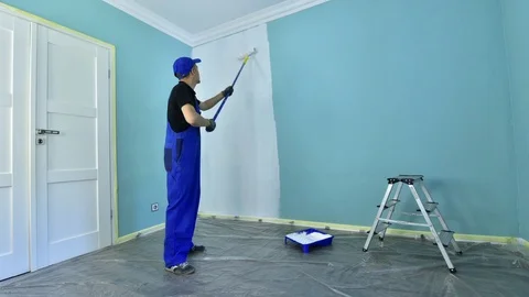 Man in a working overall Stock Footage 89830823