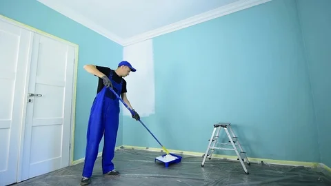 Man in a working overall Stock Footage 89832116