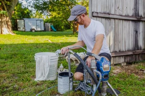 Man Working with Paint Gun Stock Photos