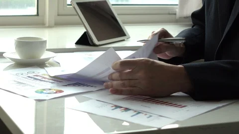 Man working with paperwork in the office Stock Footage 86167182