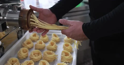 Man working with Pasta manufacture machine - Home made pasta Stock Footage 162550438