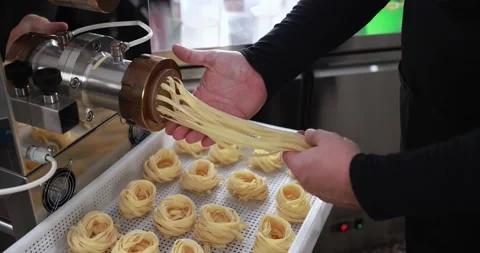 Man working with Pasta manufacture machine Stock Footage 162550464
