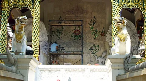 Man is working on the patterned wall in the temple wall Stock Footage 64051588