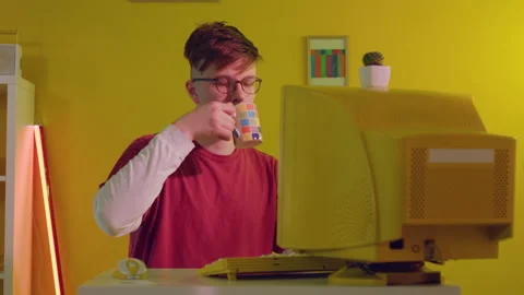 Man Is Working at PC and Drinking Tea Stock Footage 166115019