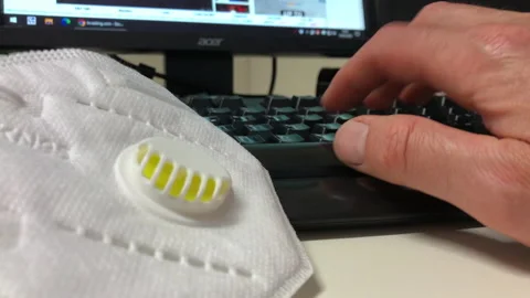 Man is working in pc during covid 19 (coronavirus) period Stock Footage 130837469