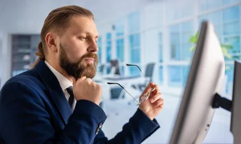 Man working on pc at office Stock Photos