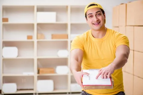Man working in postal parcel delivery service office 写真素材