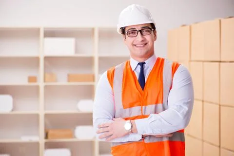 Man working in postal parcel delivery service office 스톡 사진