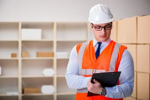 Man working in postal parcel delivery service office 스톡 사진