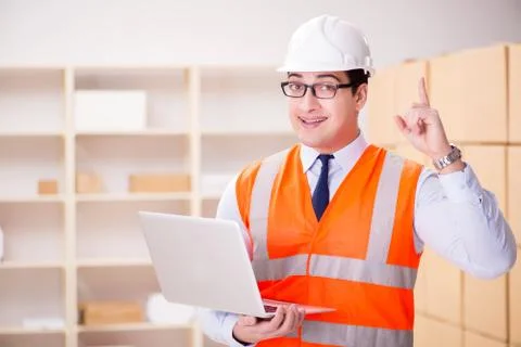 Man working in postal parcel delivery service office 写真素材