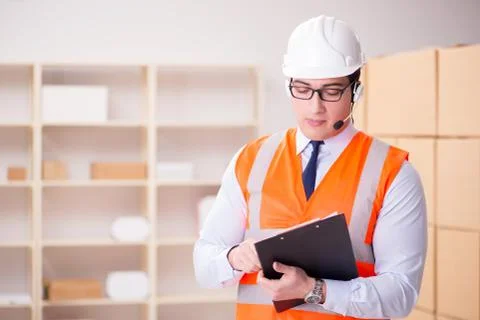 Man working in postal parcel delivery service office 스톡 사진