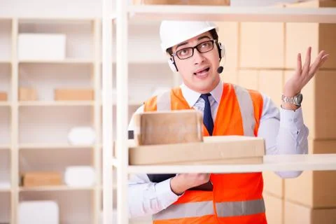 Man working in postal parcel delivery service office 스톡 사진