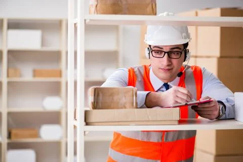 Man working in postal parcel delivery service office 스톡 사진