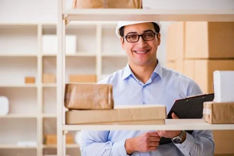 Man working in postal parcel delivery service office 写真素材