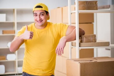 Man working in postal parcel delivery service office 写真素材