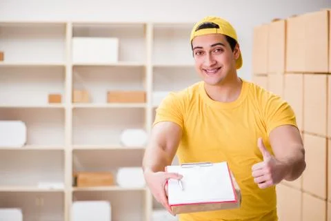 Man working in postal parcel delivery service office 写真素材